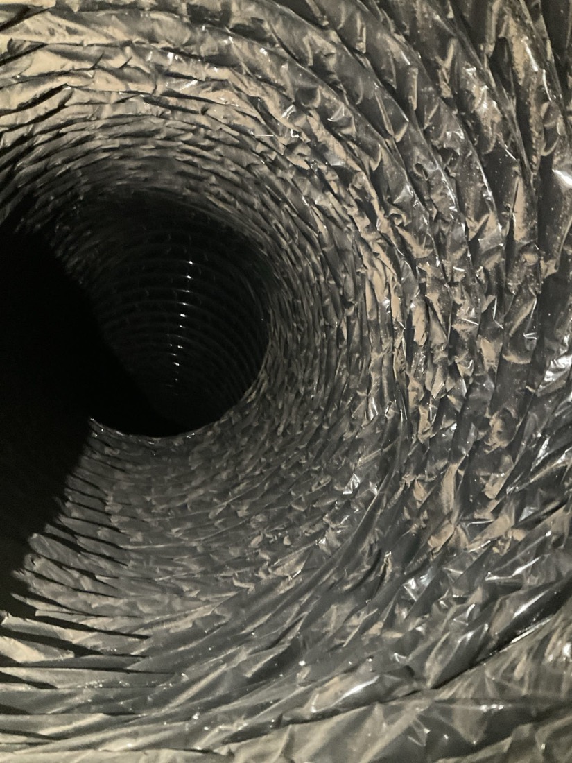 Clean blower wheel with detailed view of fins after professional duct service.