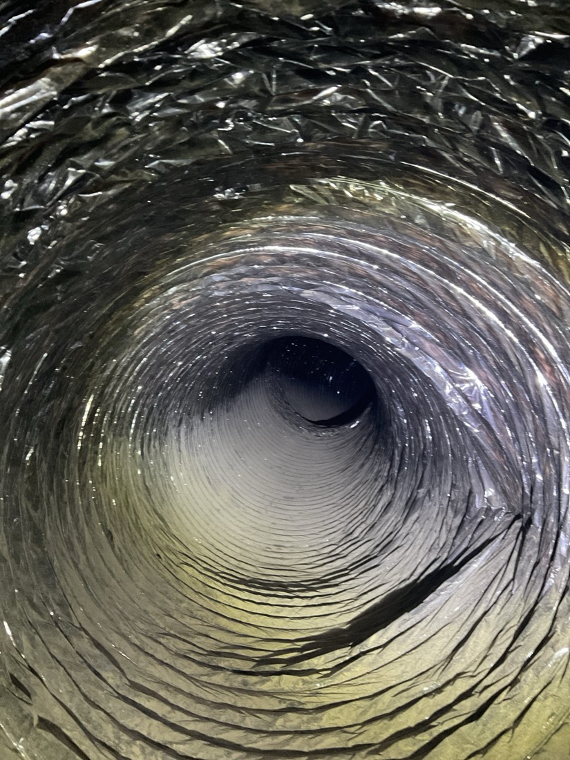 Interior of metal duct showing detailed cleaning results