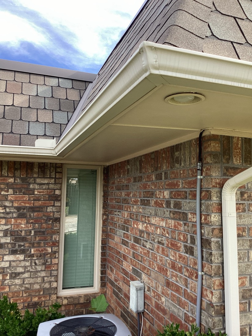 New electrical outlet installed on brick home exterior