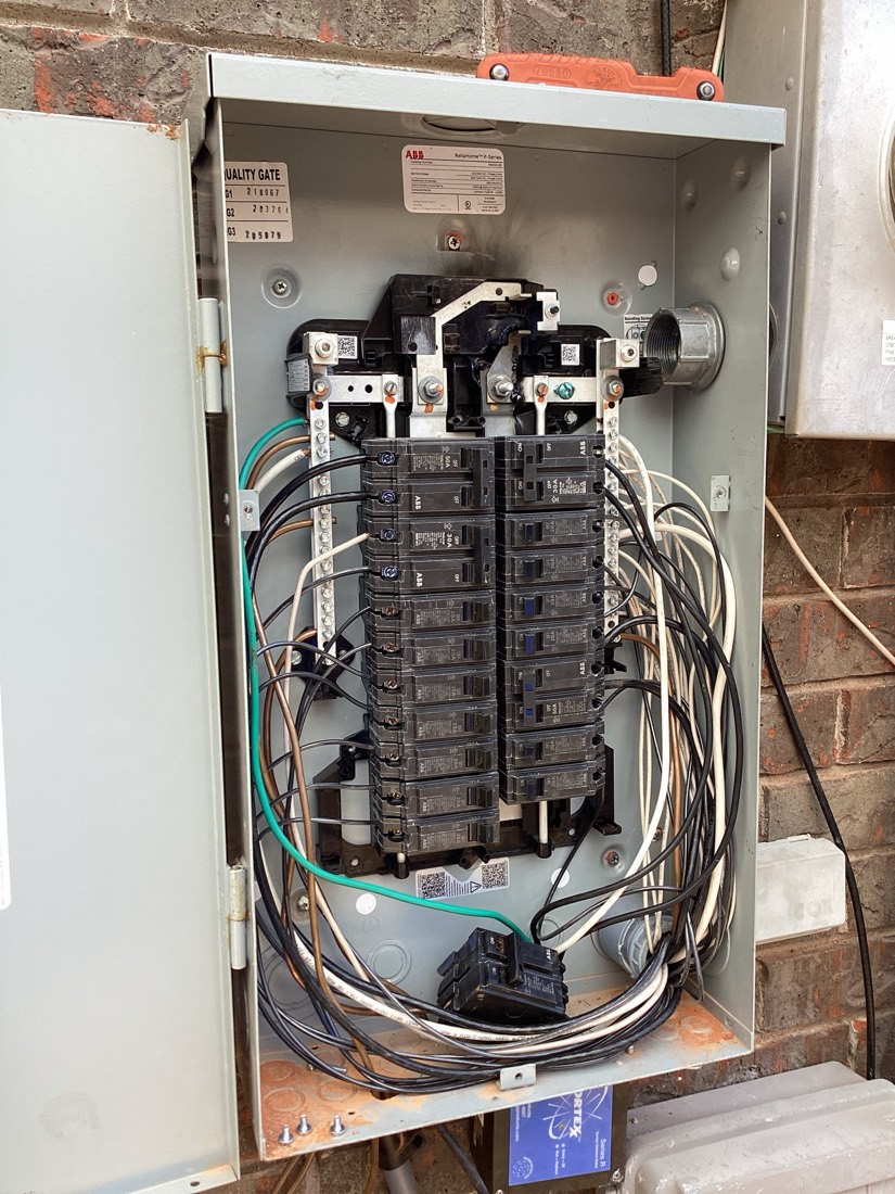 Main electrical panel with organized breaker installation and wiring.