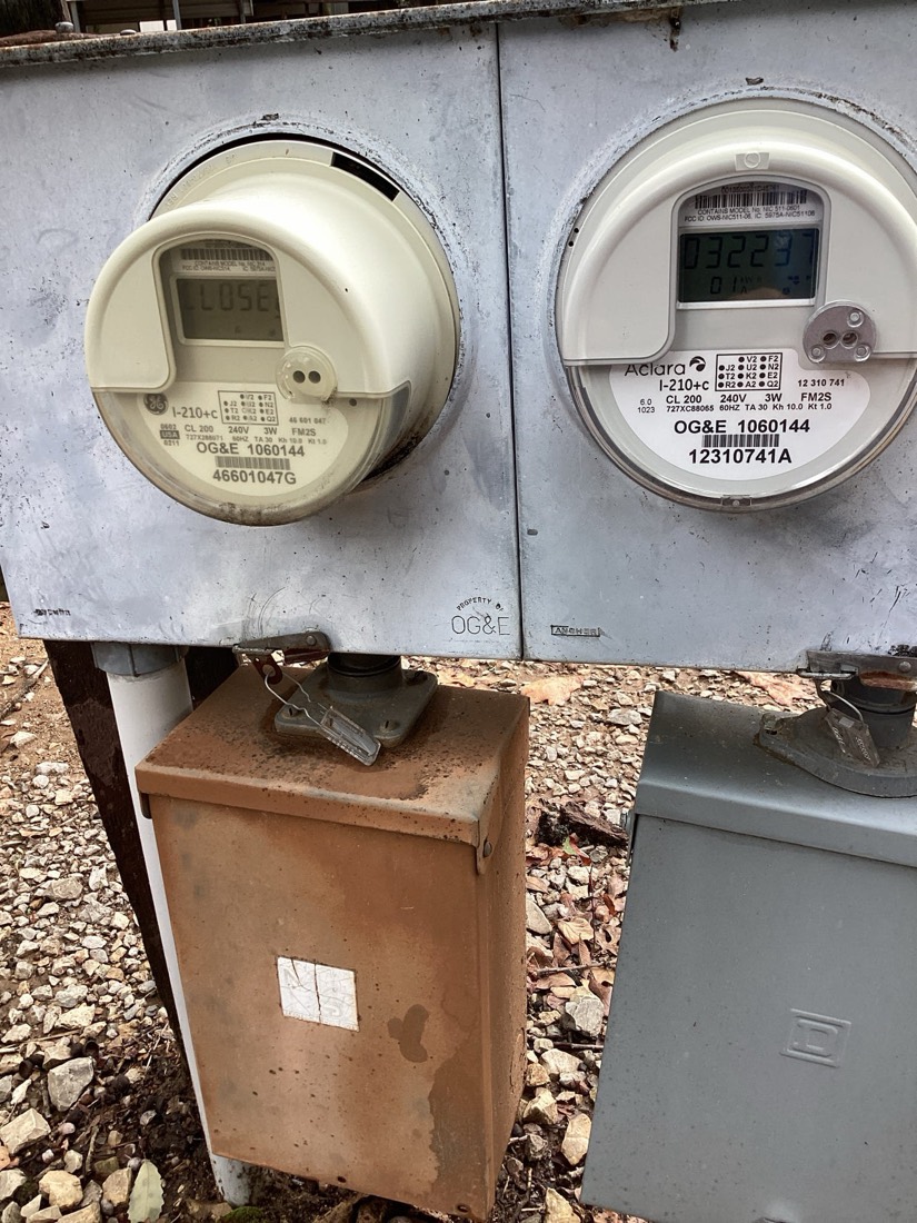 Two newly installed electrical meters on mounting panel