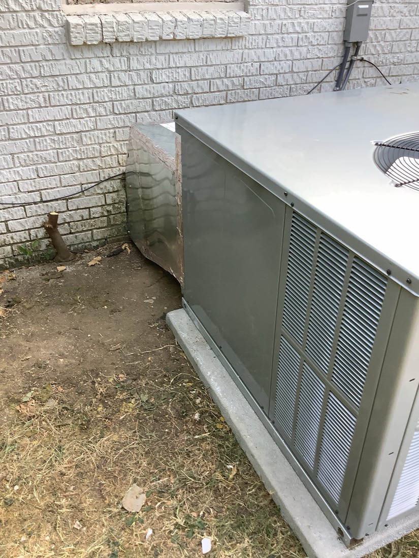New AC condensing unit with properly installed refrigerant and electrical lines